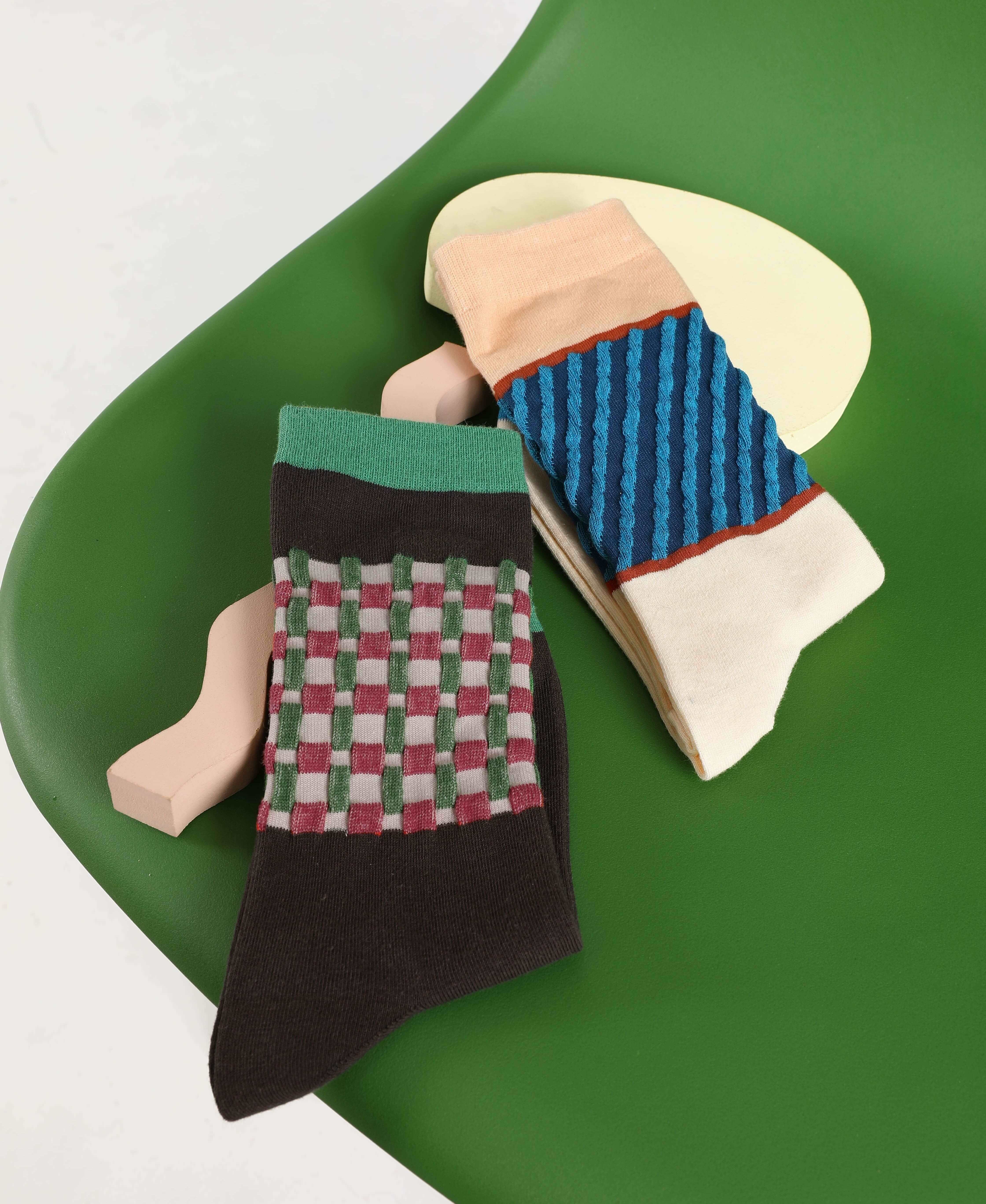 A display of Korean style winter socks, perfect for New Year's celebrations, presented on a green chair
