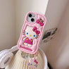 Hello Kitty iPhone case paired with pink silicone earbuds