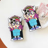 Pair of iPhone cases showcasing Arale with glasses in a cute design