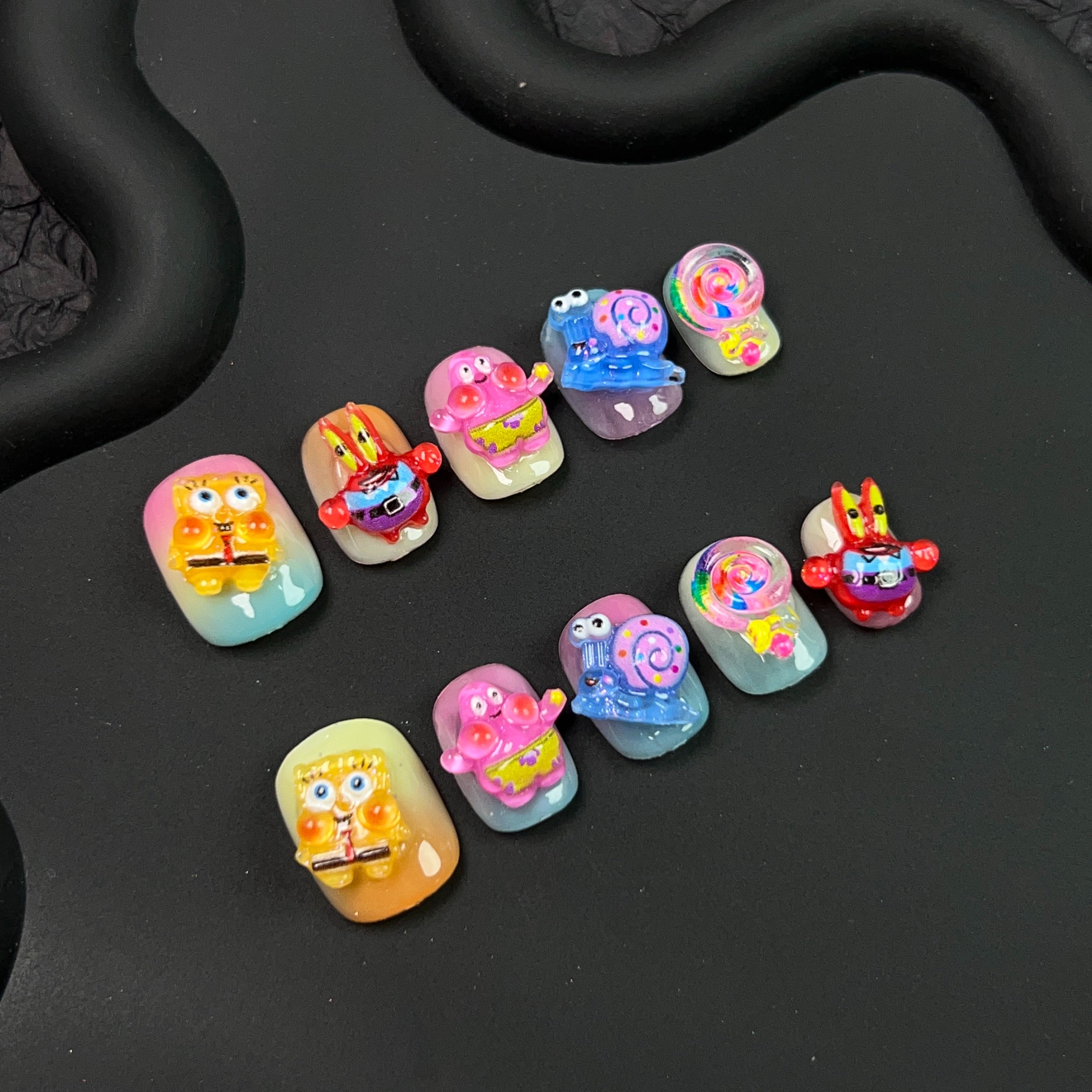 Cartoon character designs featured on press-on nail set