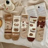 A collection of five pairs of cozy bear-themed thermal socks