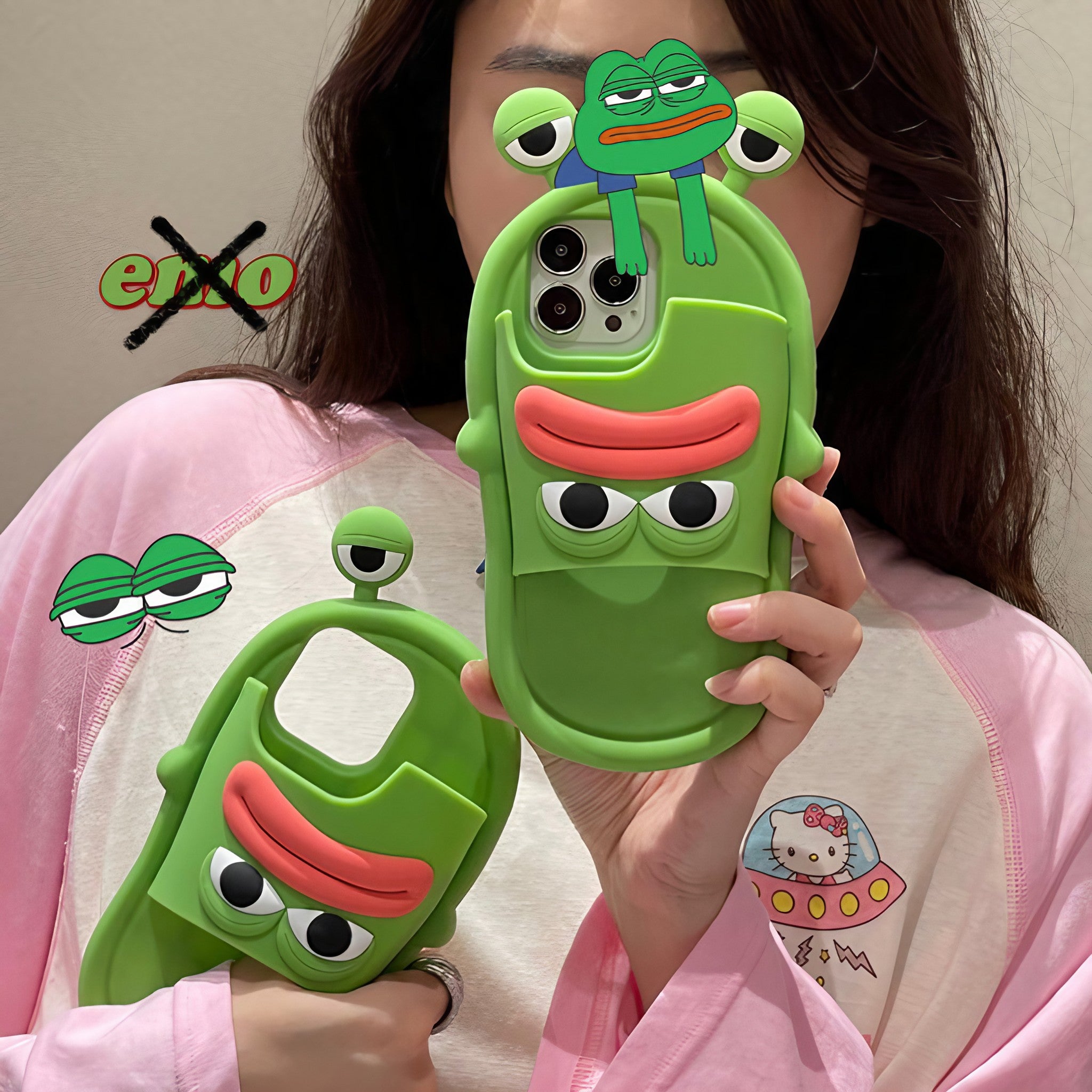 Female hand showcasing a frog cartoon silicone case for iPhone 13 Pro