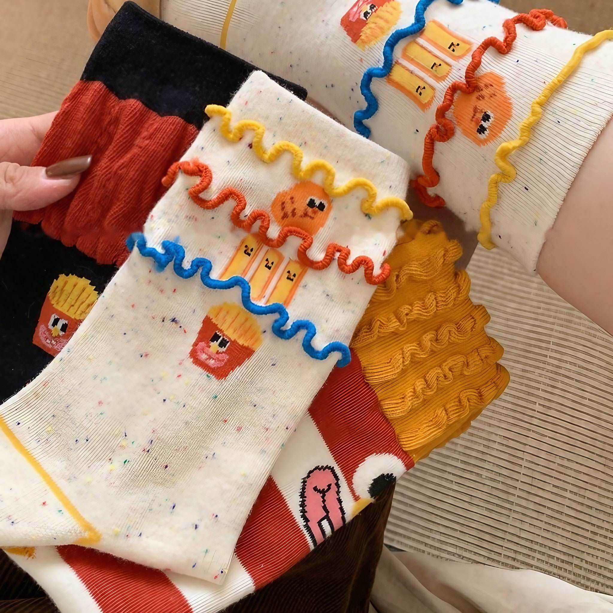 Set of three McDonald's funny socks with vibrant French fry motifs