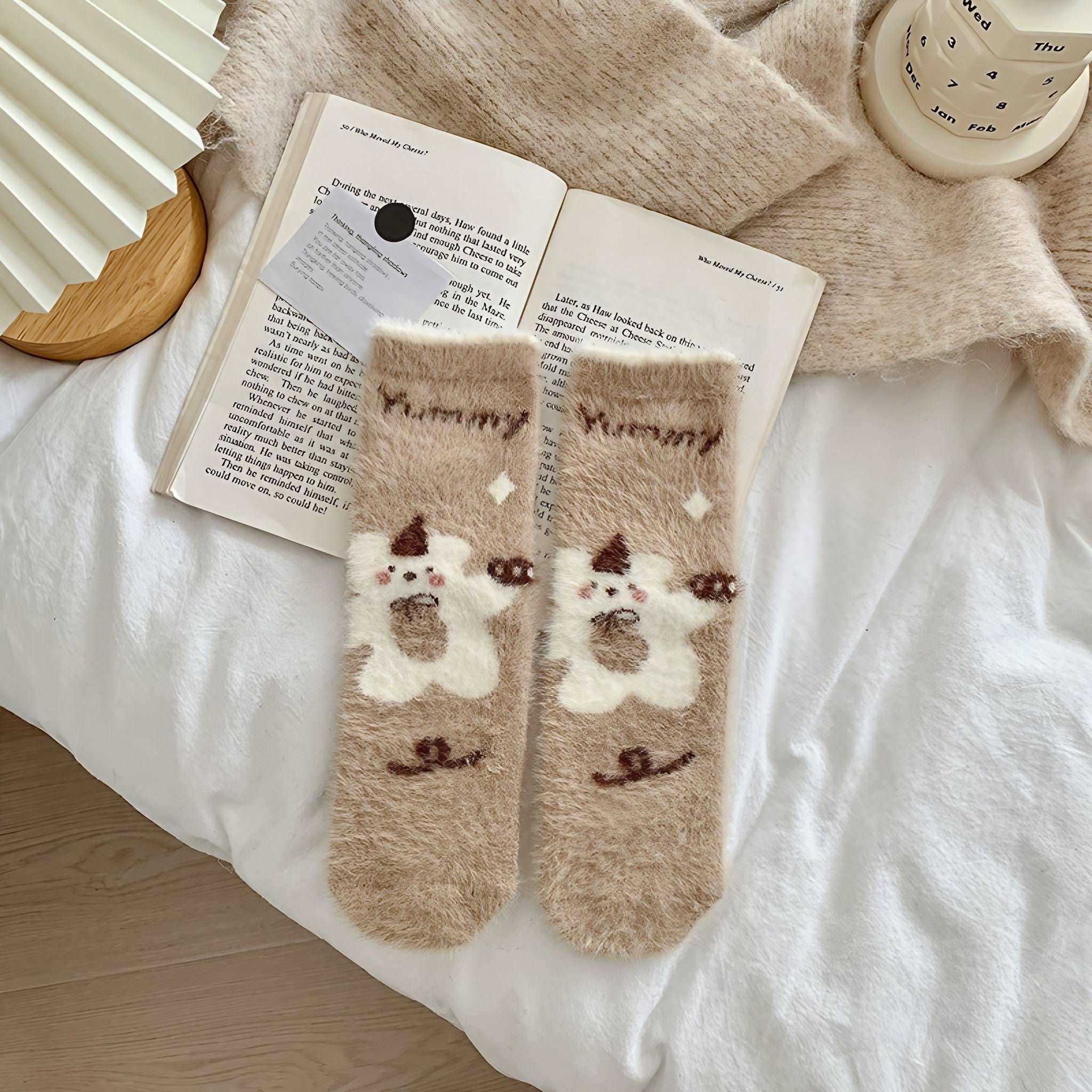 Close-up of thermal plush socks featuring a cute bear design