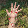 Model showcasing a unique red beaded Hello Kitty necklace