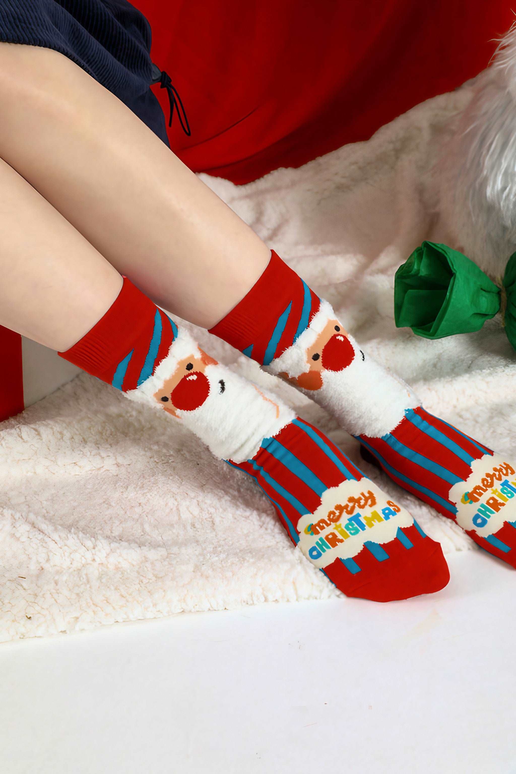 Festive red and blue socks with a cute Santa Claus design for Christmas