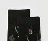 Duo of black socks with intricate flower and leaf patterns