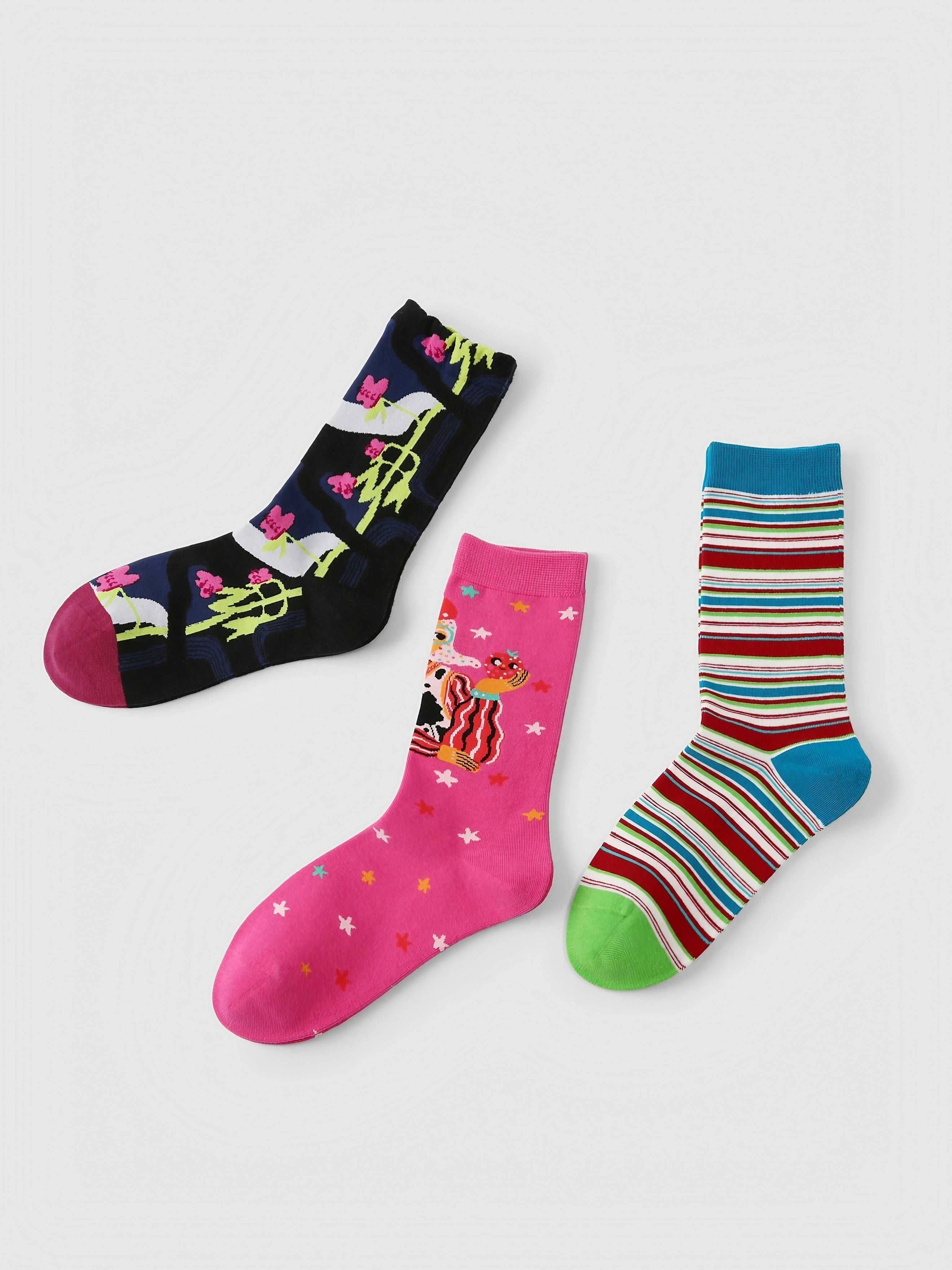 Display of three Blackpink socks sets with unique and colorful designs