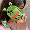 Side view of a woman displaying a green frog silicone case for iPhone 13 Pro Max