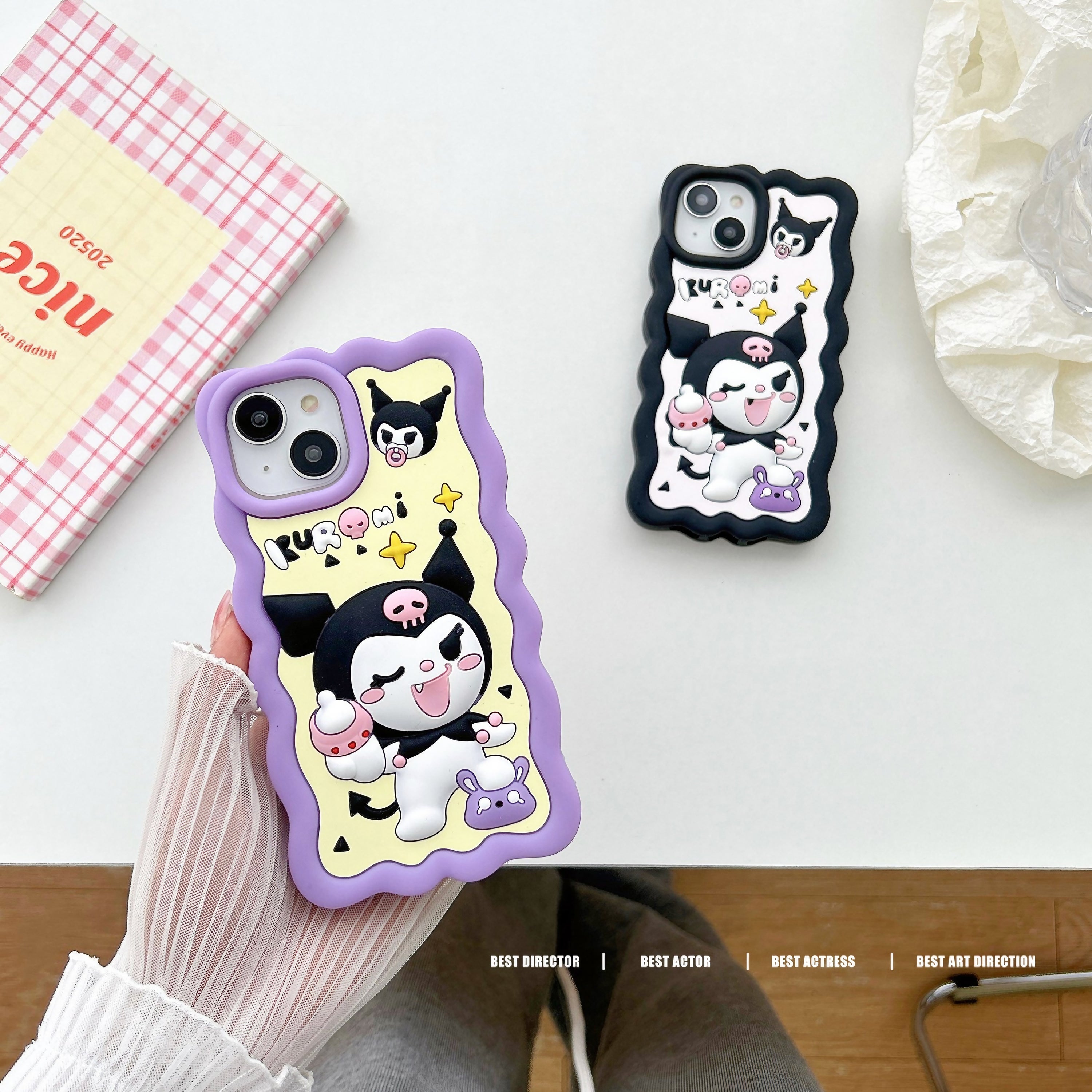 Hand holding a Kuromi iPhone case featuring Kuromi that's winking