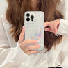 Individual showcasing a glitter-filled phone case for Gen Z iPhone users