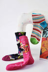 A trio of Blackpink Funky Socks in assorted patterns displayed on a chair