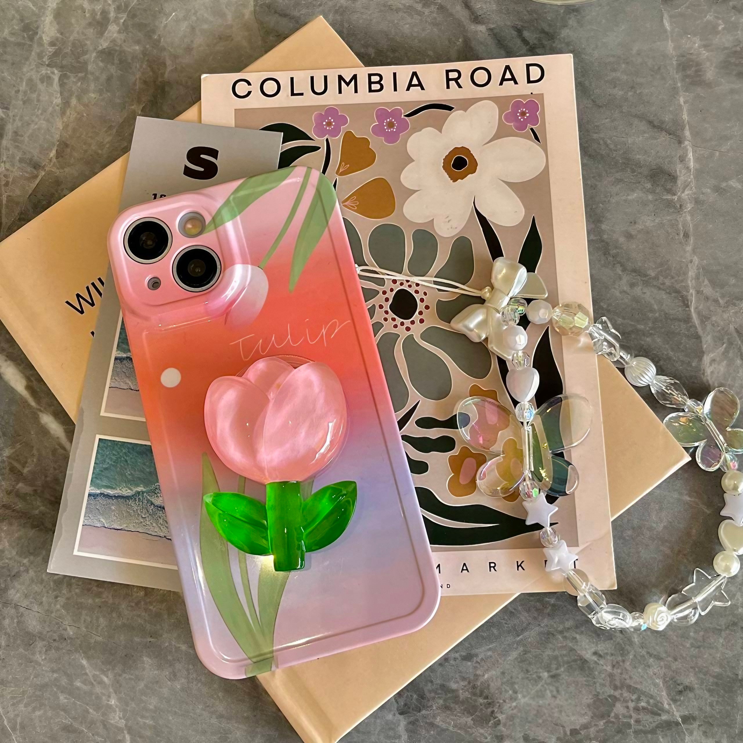 Top view of the Pink Tulip iPhone Case emphasizing the single flower phone stand and white phone chain for iPhone 14 Pro Max