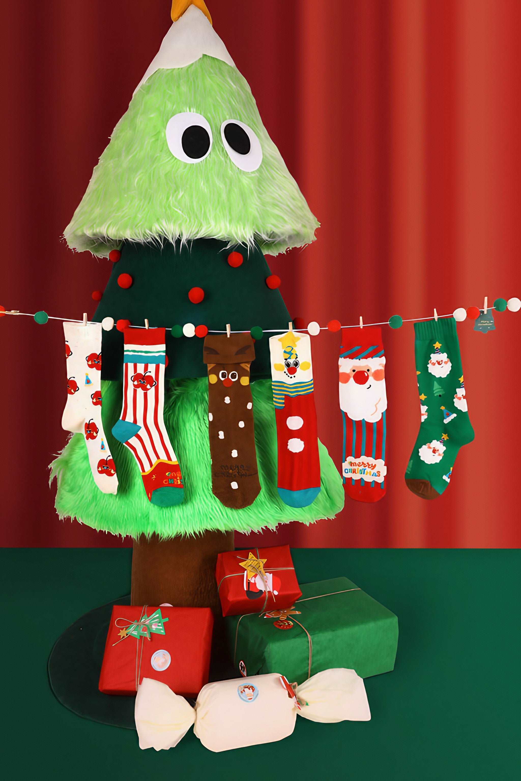 Decorative Christmas stockings hung with care on a festively adorned tree