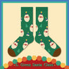 Christmas socks with a jolly Santa Claus pattern against a green backdrop