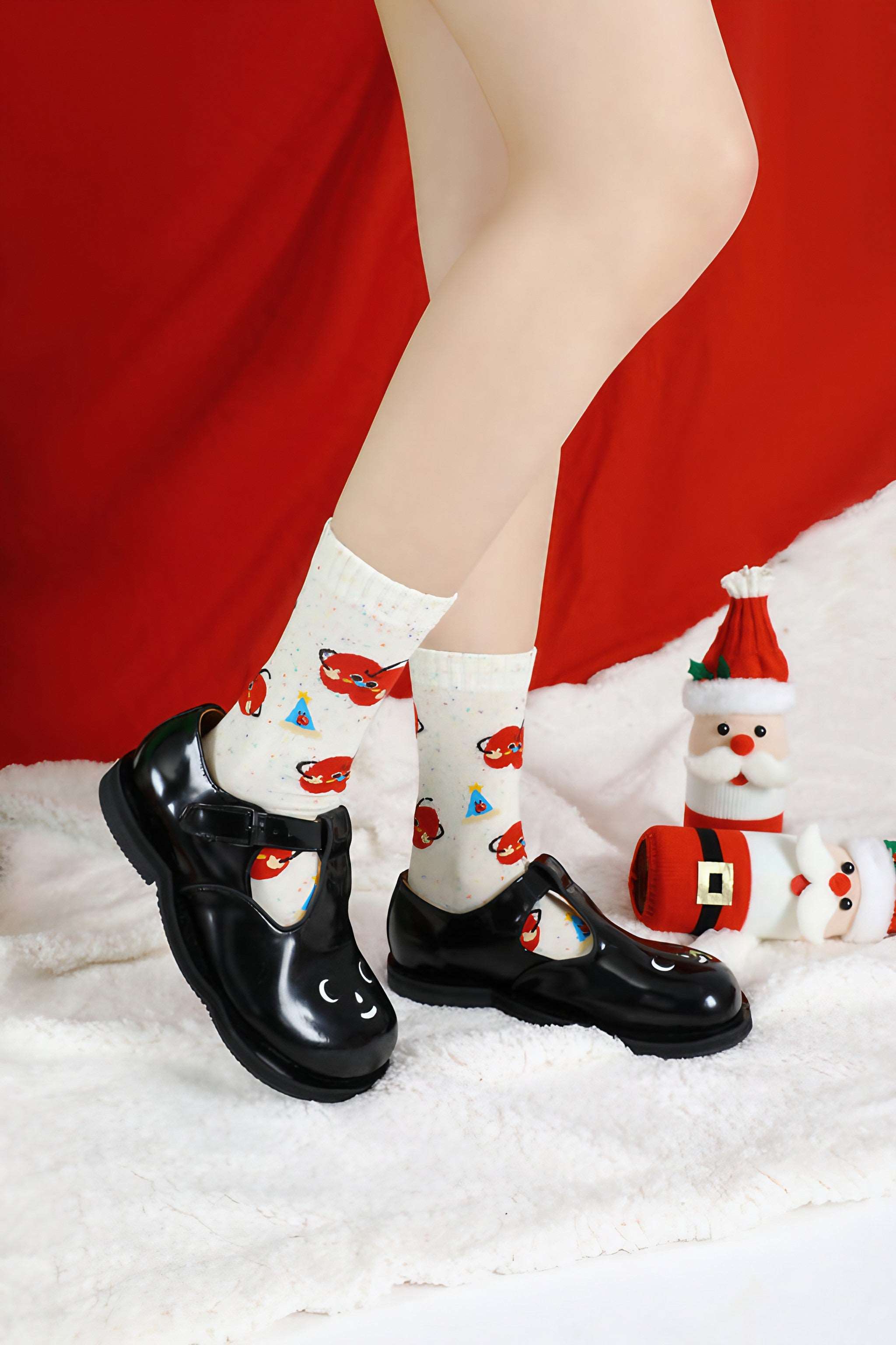 Socks with a unique red and white apple pattern suitable for the holiday season