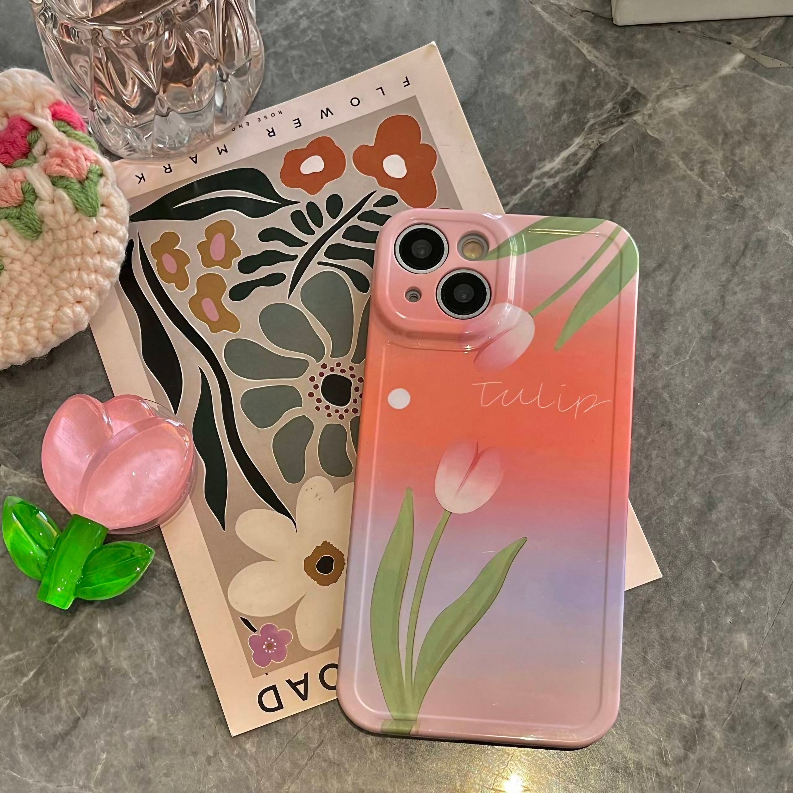 Angled shot of the Pink Tulip iPhone Case with floral phone holder for iPhone 14