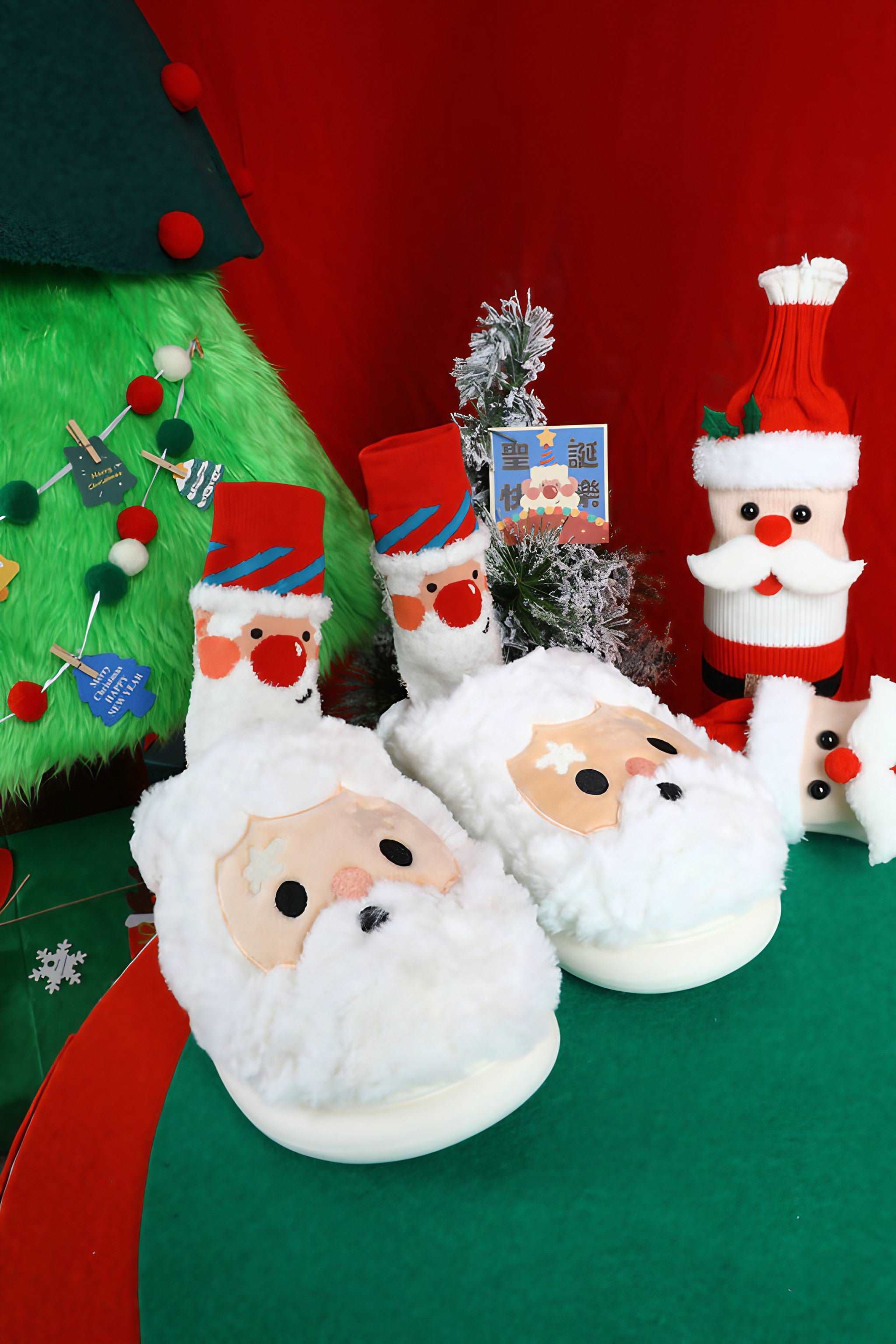 Christmas-themed fuzzy Santa Claus socks and holiday decor surrounding a Christmas tree