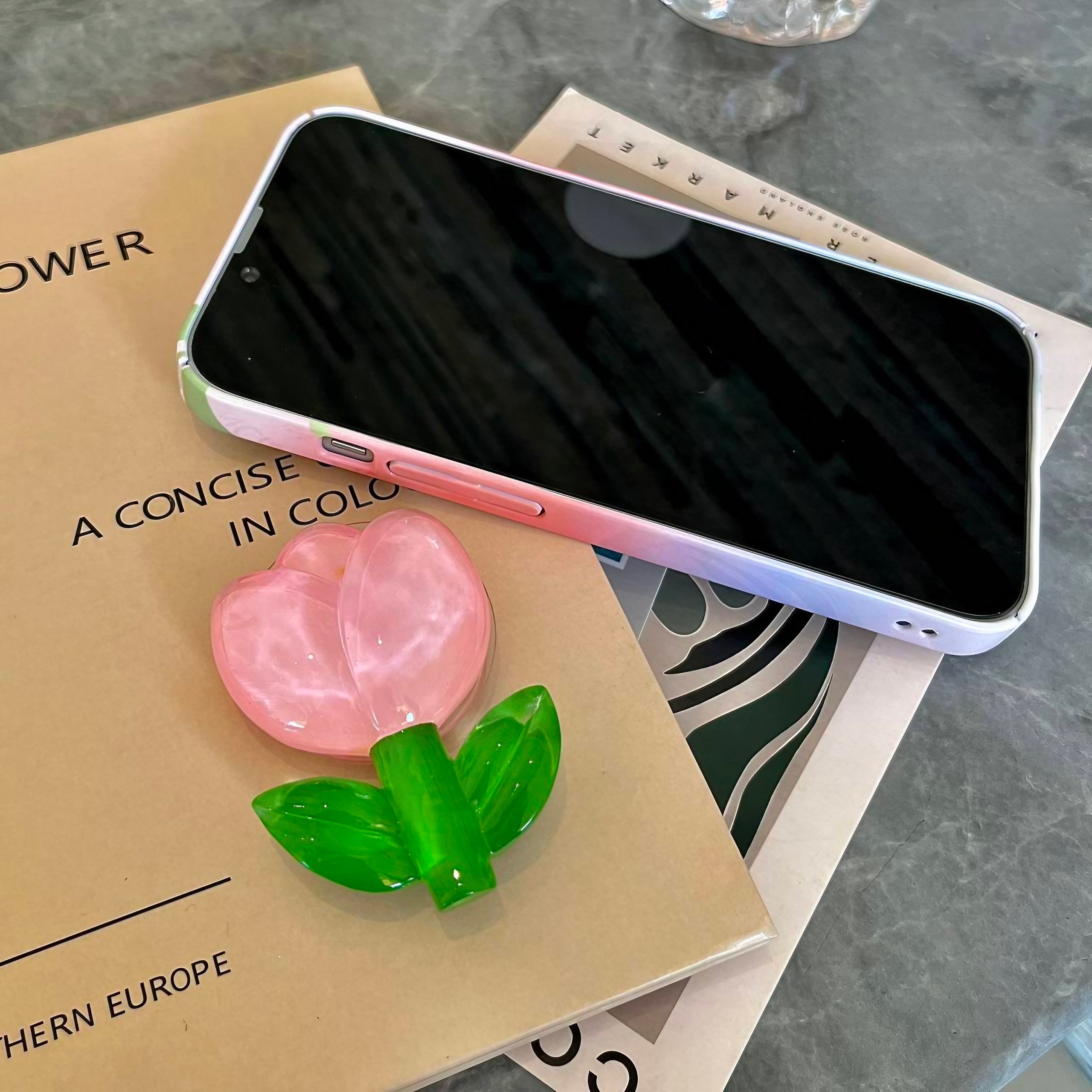 Detail of the Pink Tulip iPhone Case highlighting the pink tulip and green leaf phone stand for iPhone 13 Pro Max