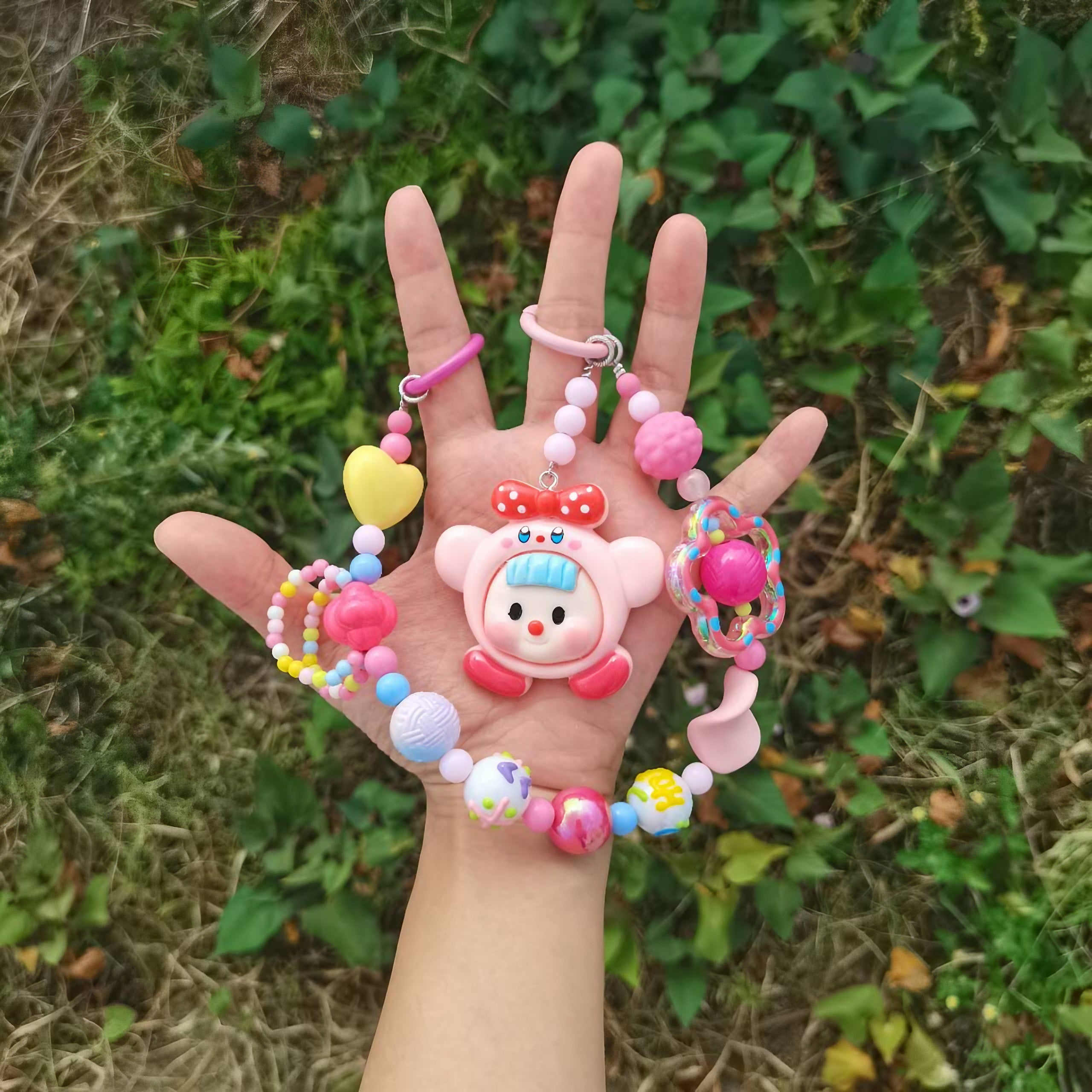 Model holding the Pink Princess Bag Chain with a Kirby character charm for Gen Z fashion