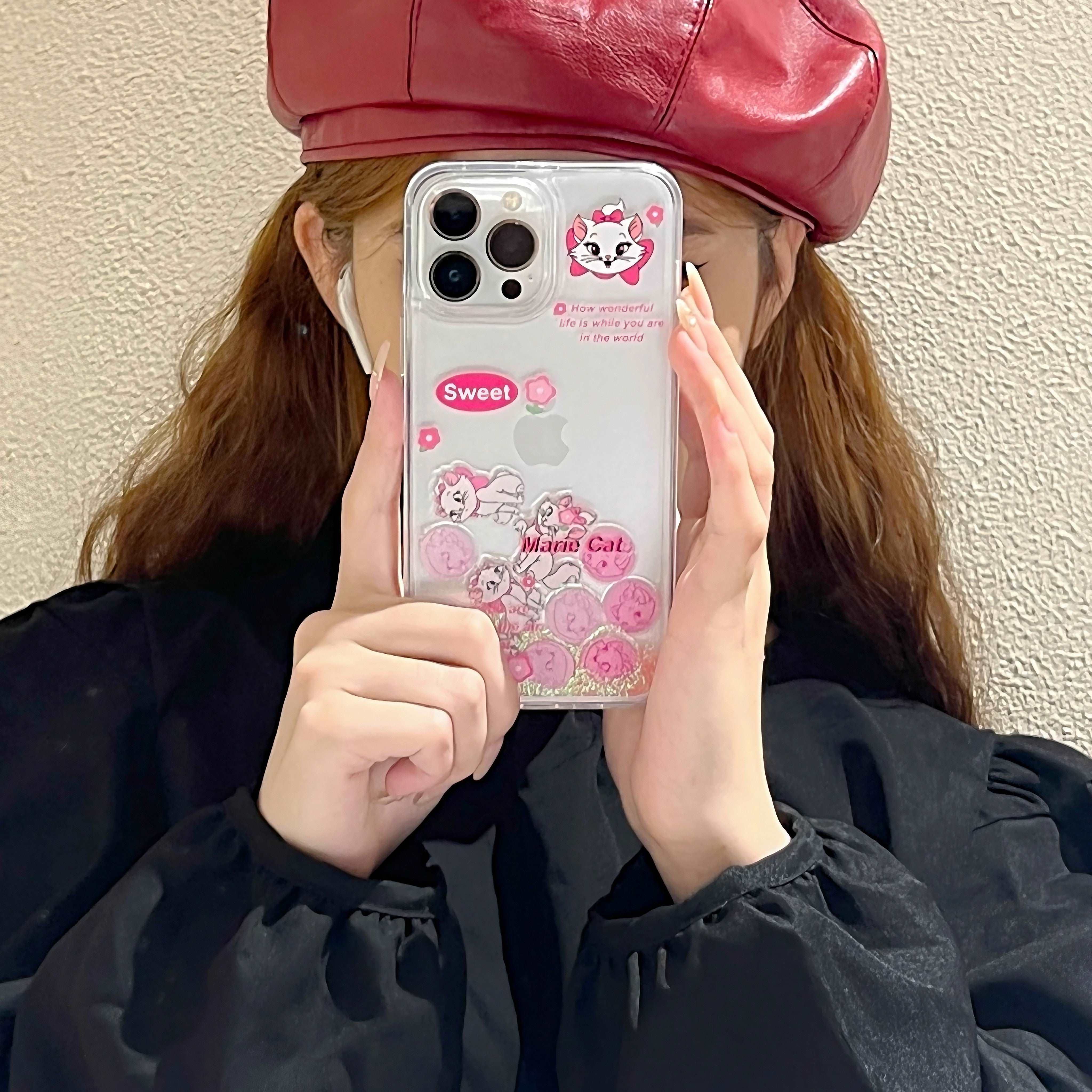 Fashionable Gen Z style iPhone case with Marie the Cat held by a girl with a hat