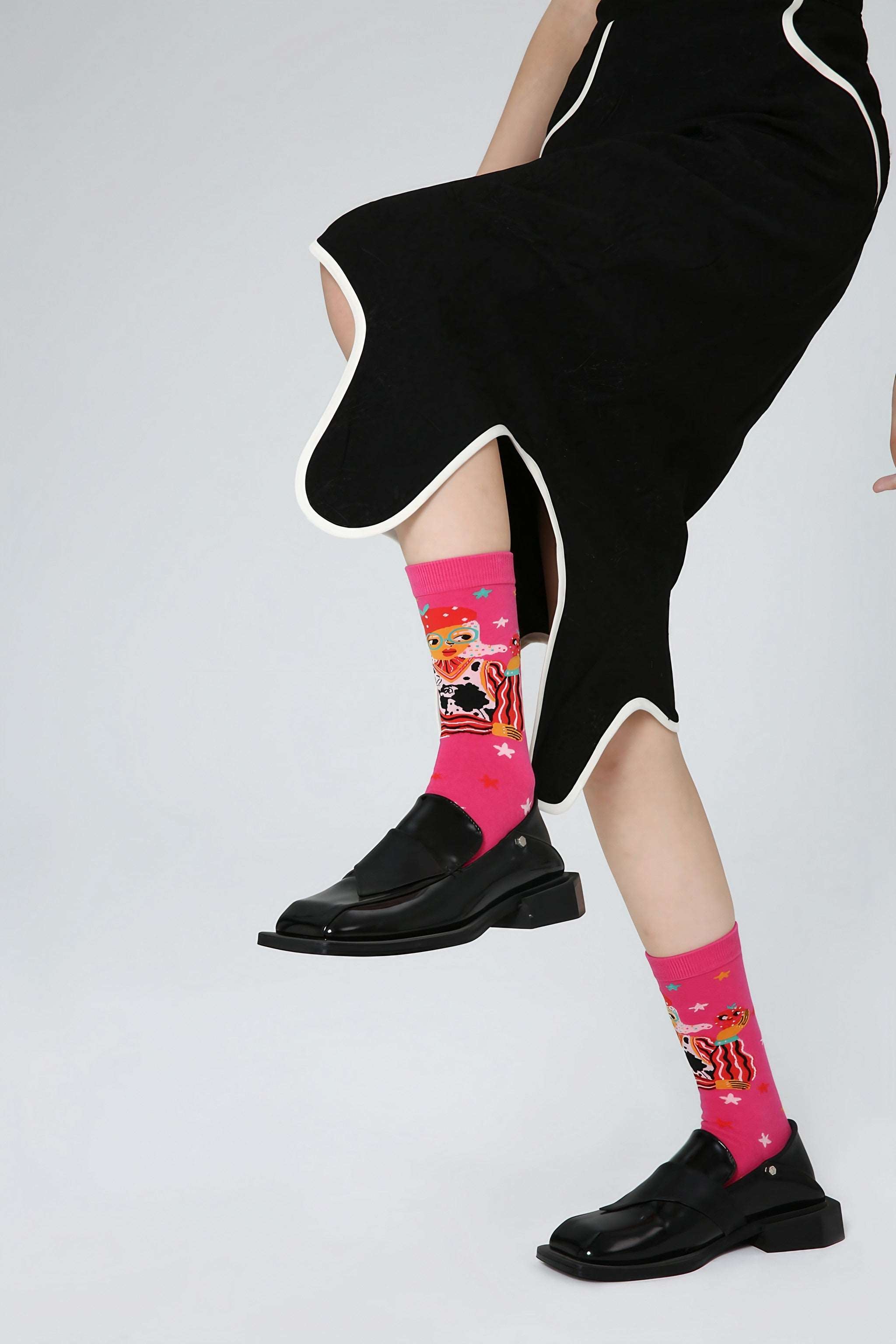 A pair of Blackpink themed socks with funky patterns for women