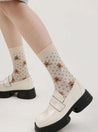 Female feet adorned with the cute bear print from the Brown Bear Socks se