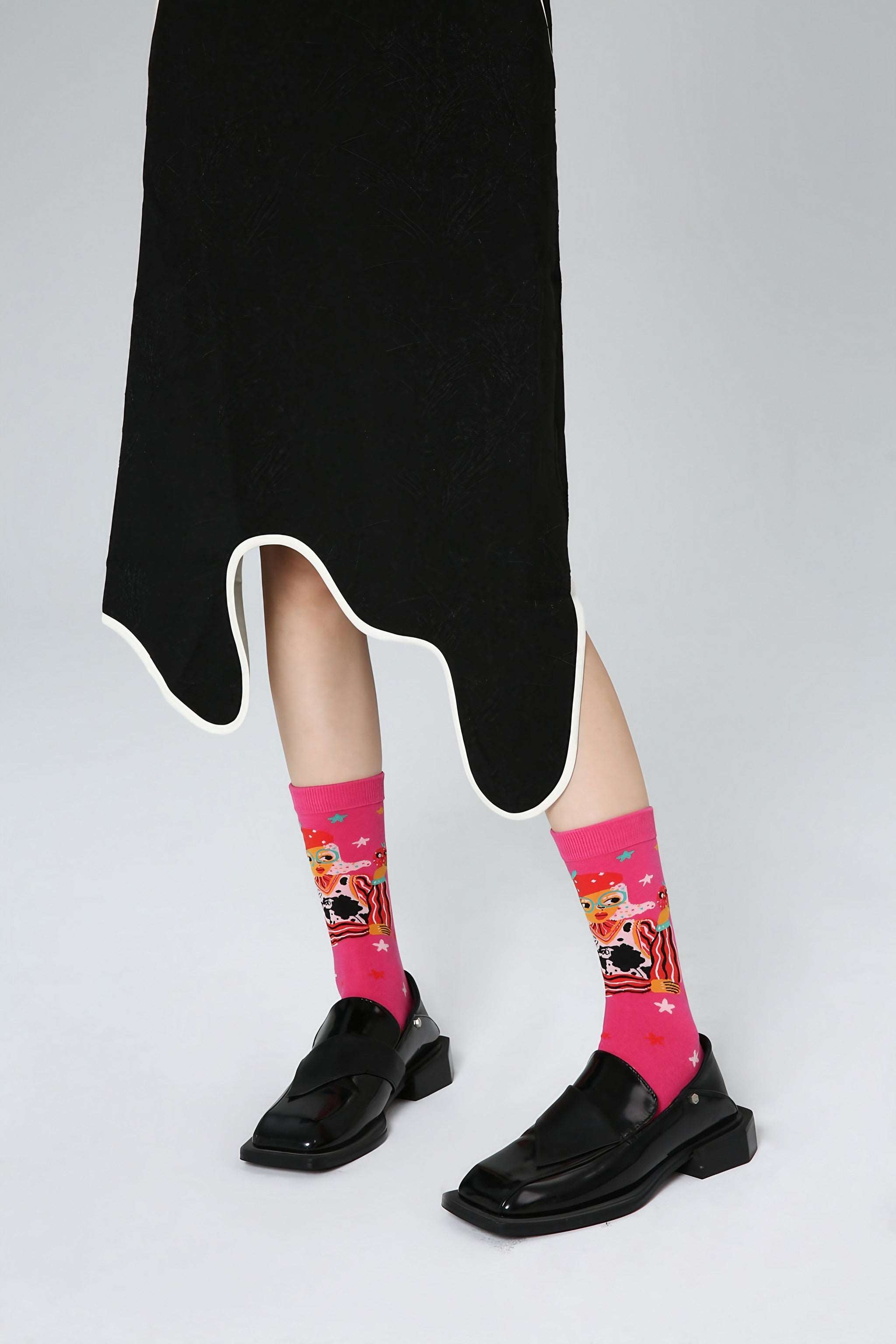 Trendy pink socks from the Blackpink set paired with chic black shoes