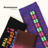 An assortment of three Blackpink Purple Tektonik socks featuring colorful Y2K fashion-inspired motifs