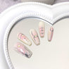 A collection of Ballet Coquette Daily Nails displayed on a reflective surface