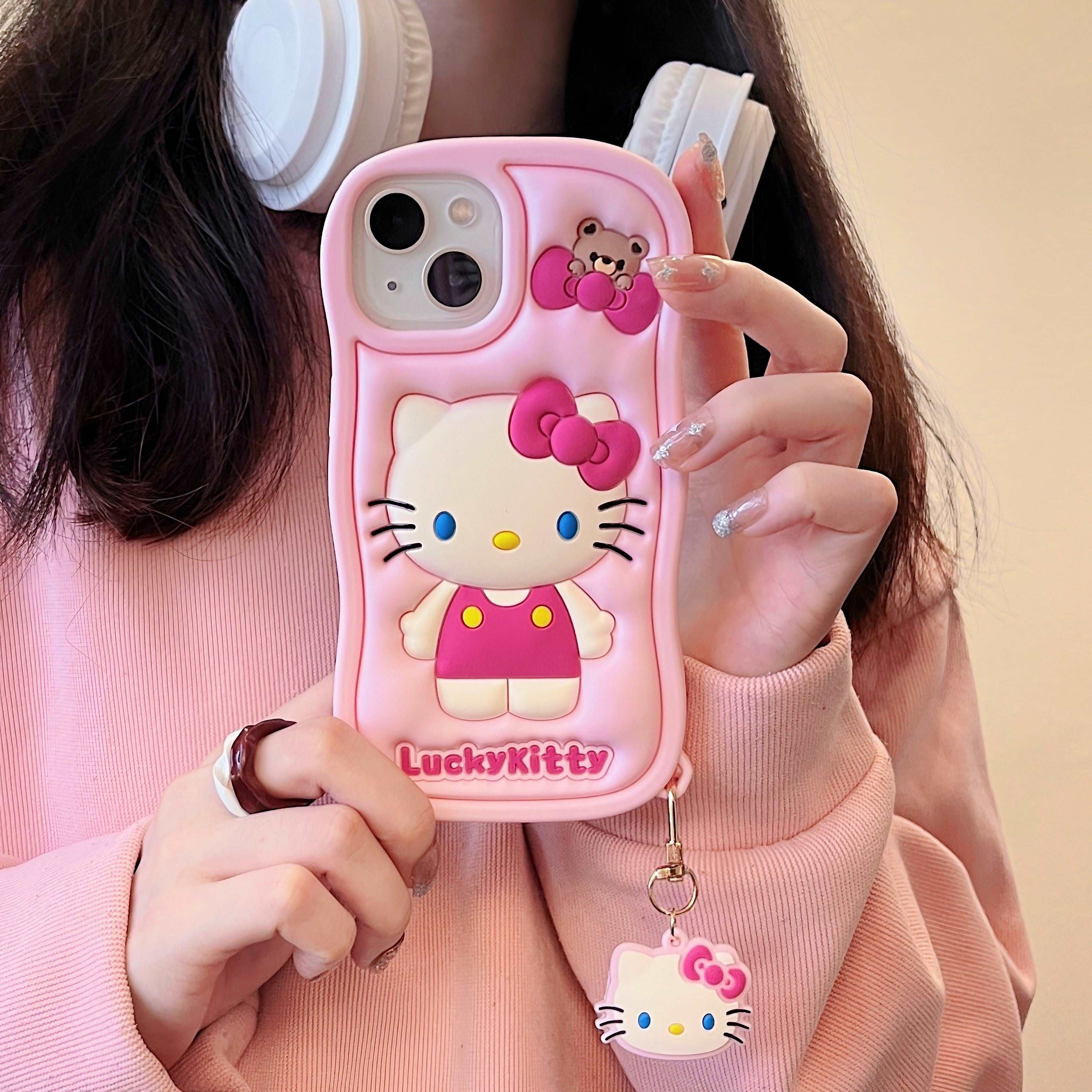 Hand displaying Hello Kitty case for iPhone 13 Pro