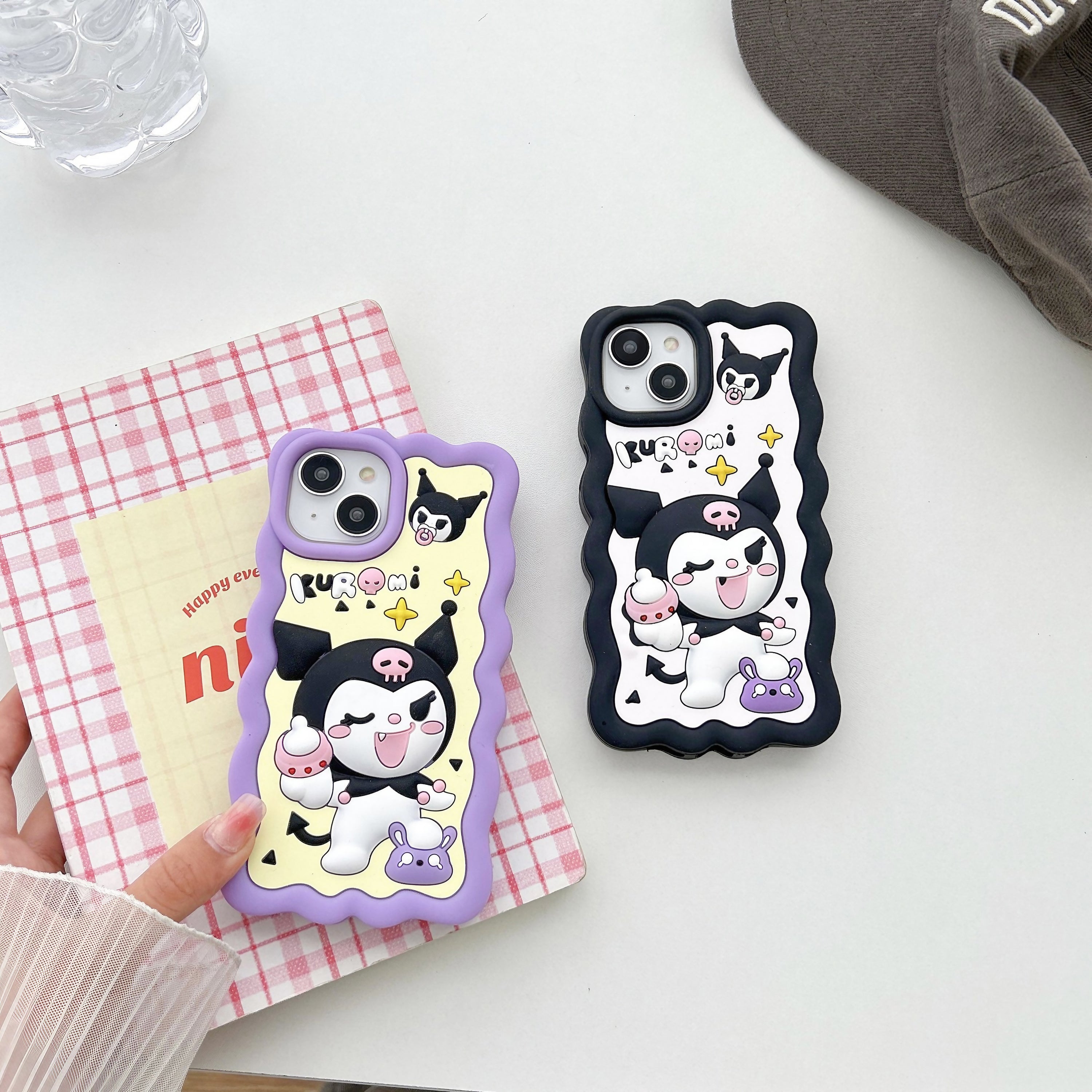 Set of two iPhone cases with playful Kuromi patterns