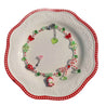 A red Hello Kitty beaded necklace artistically arranged on a white plate