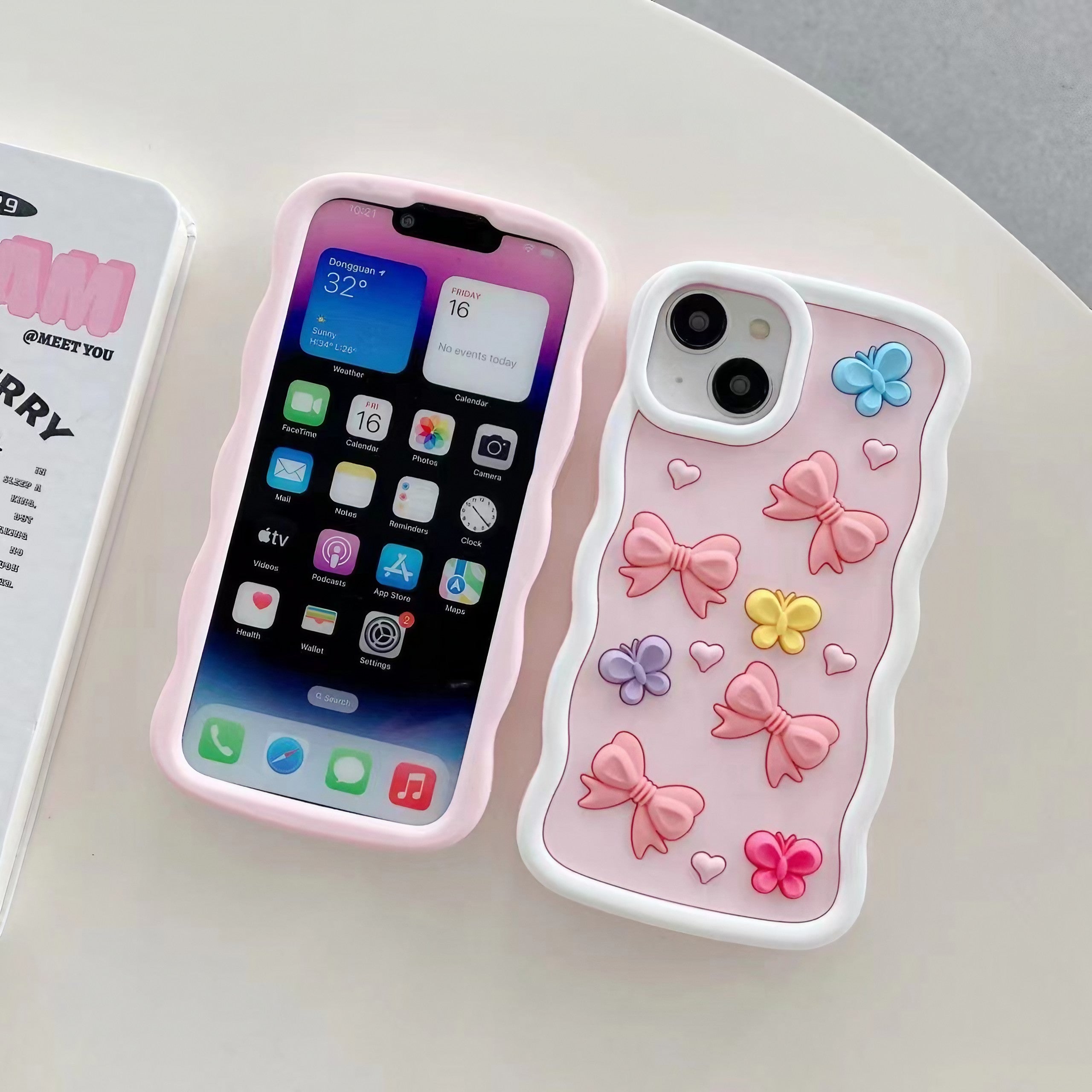 Pair of Coquette iPhone cases with elegant bow embellishments for iPhone 12 Pro Max