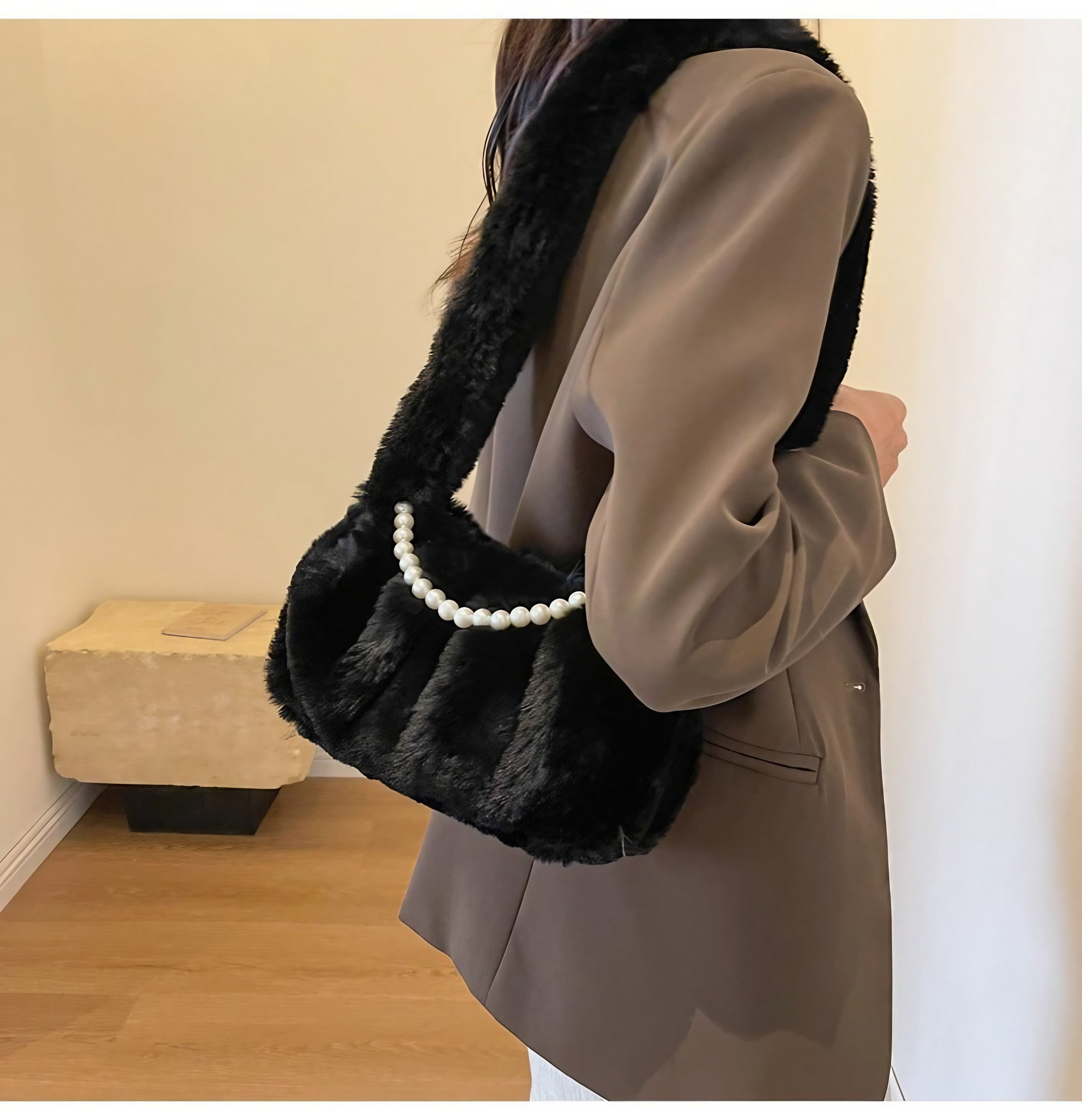 Chic black plush bag adorned with pearl details