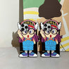 Pair of Arale cartoon character iPhone cases for 13 Pro and 14 Pro Max