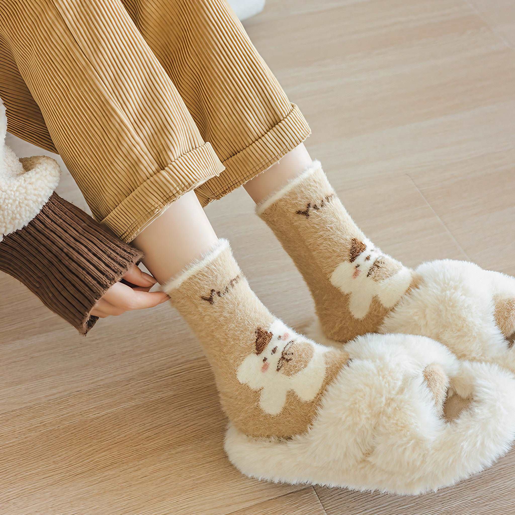 A playful pair of plush socks with a dog design worn by a woman