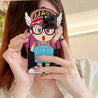 Lady exhibiting a coquette-style iPhone case with Arale manga illustration