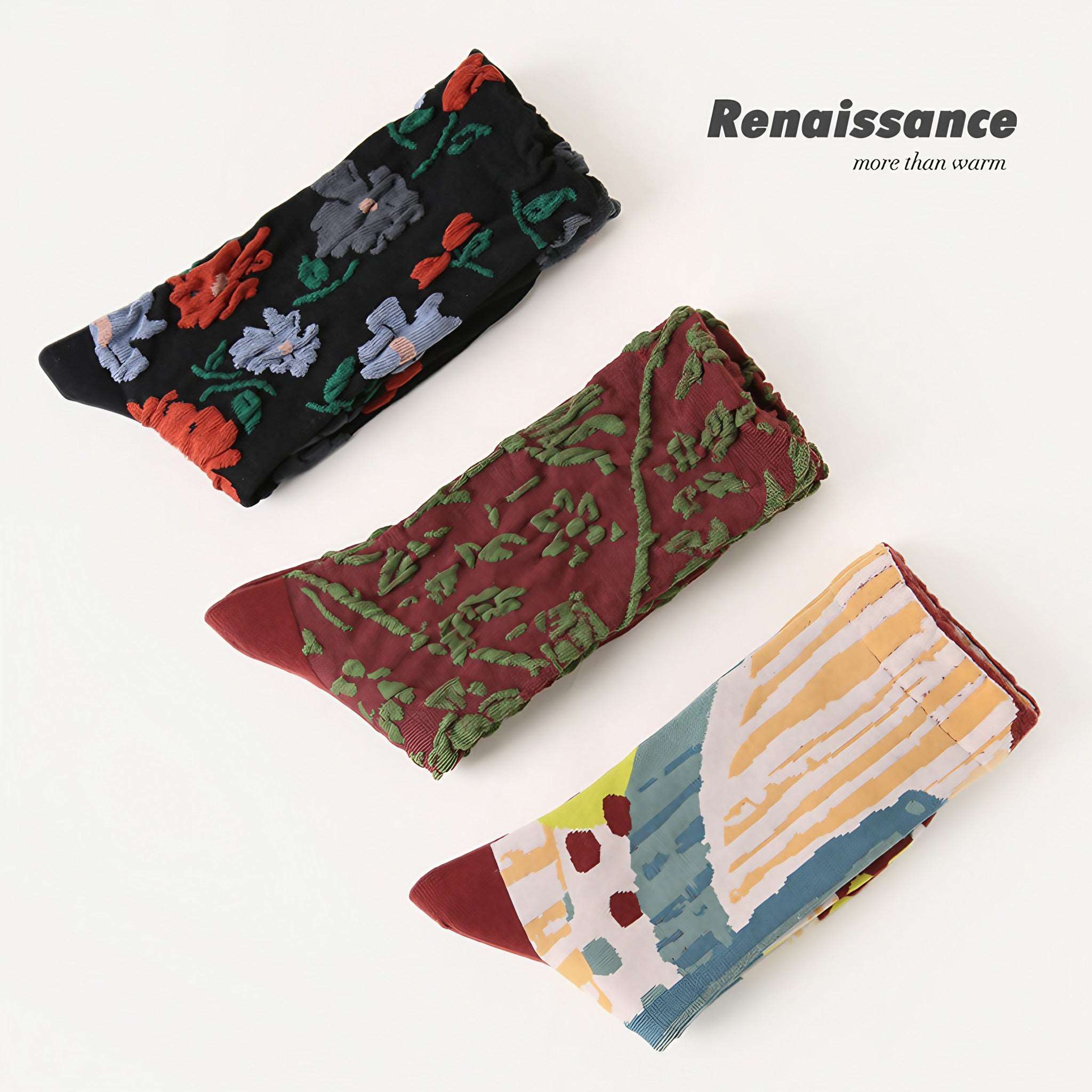 Trio of brown, black, and patterned socks from the 1+2 Socks Set with a floral motif