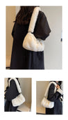 Sophisticated look featuring a woman with a white fur bag and matching black coat