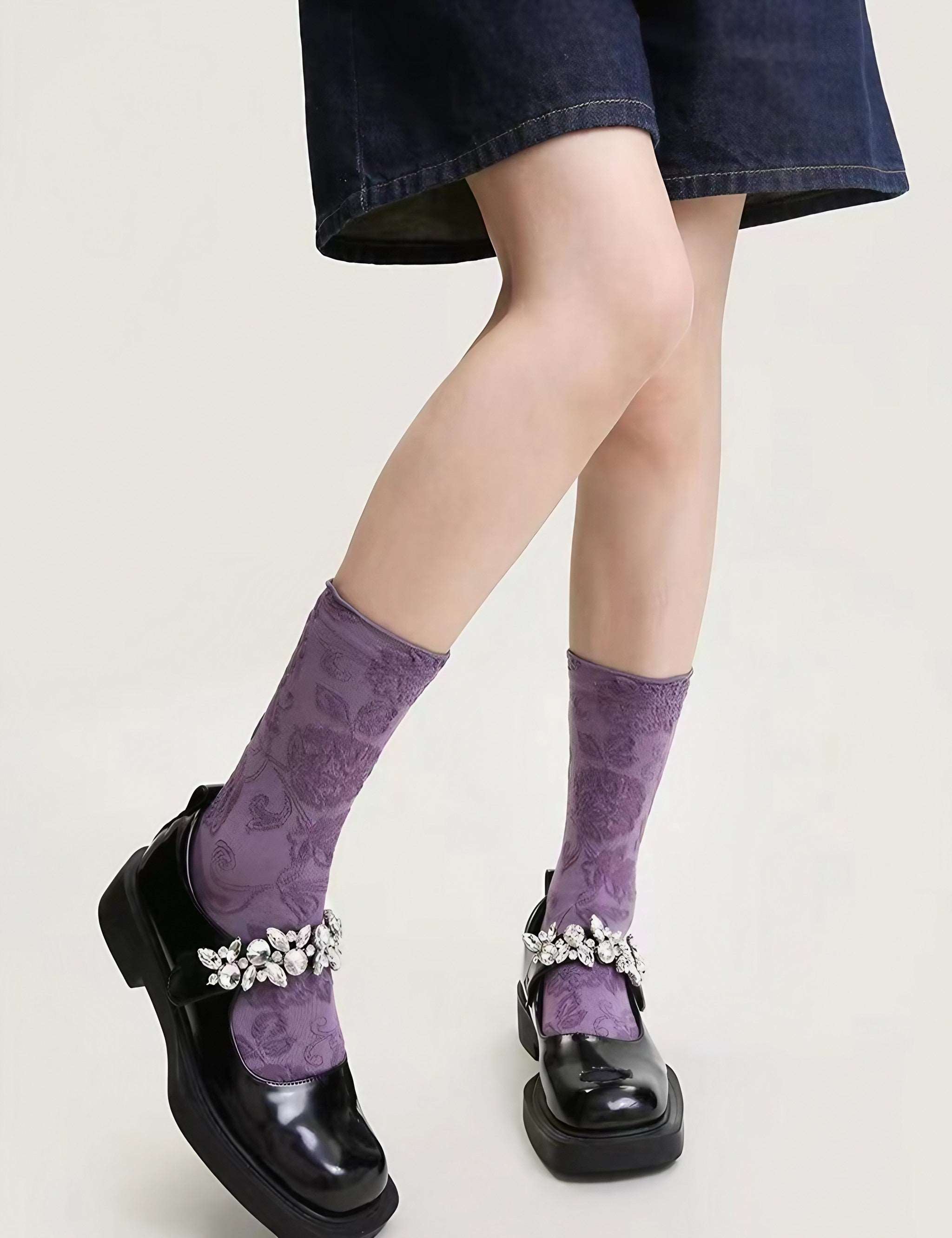 Casual look with purple socks and sleek black footwear for women