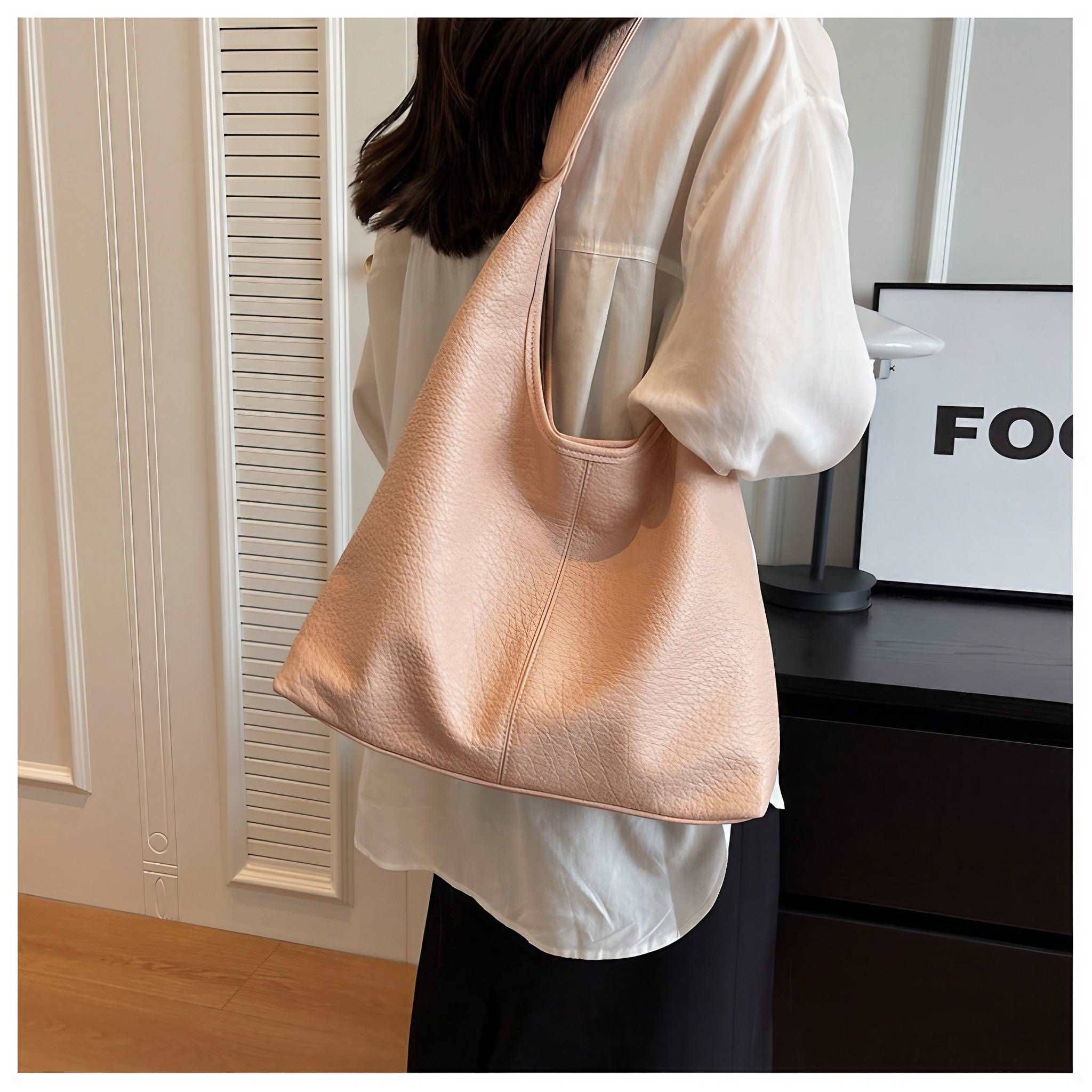 Woman showcasing the Autumn Shoulder Bag in pink with a matching pouch