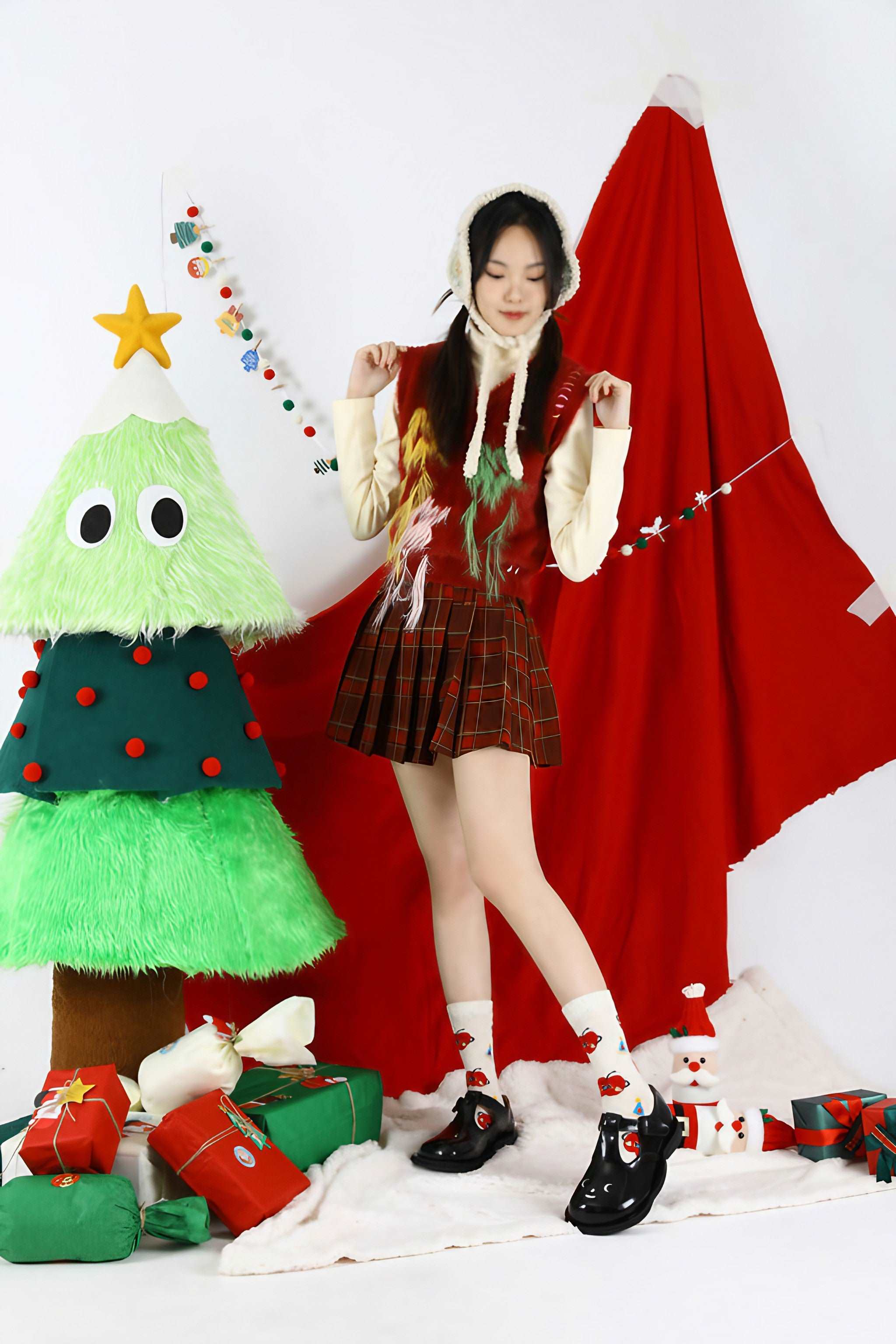 Young girl dressed in holiday socks with a Christmas tree