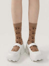 Elegant brown socks with cherry patterns all over