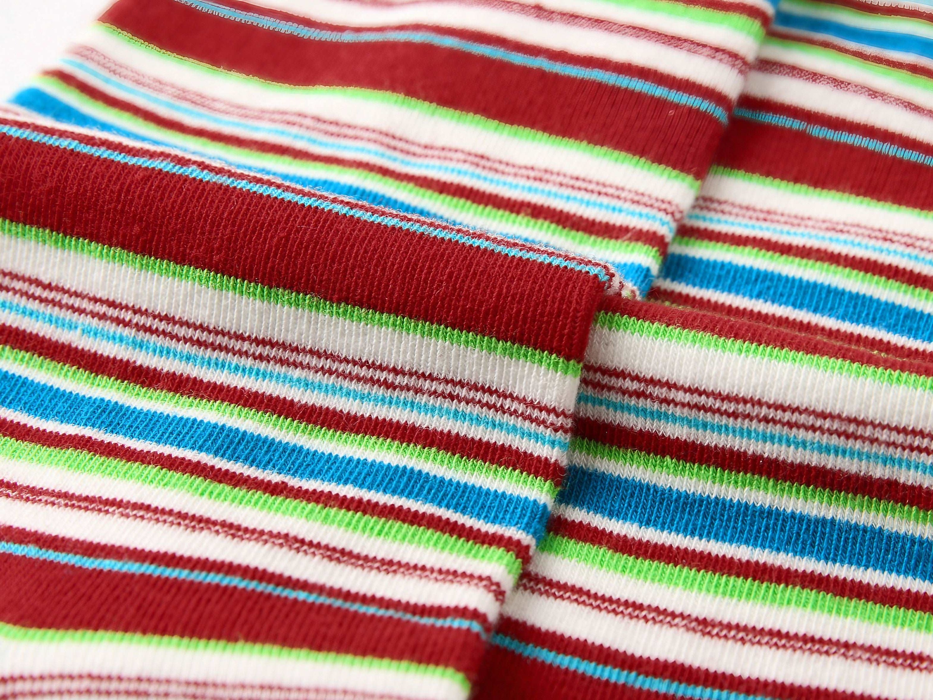 Detailed view of a Blackpink sock with red, green, and blue stripes