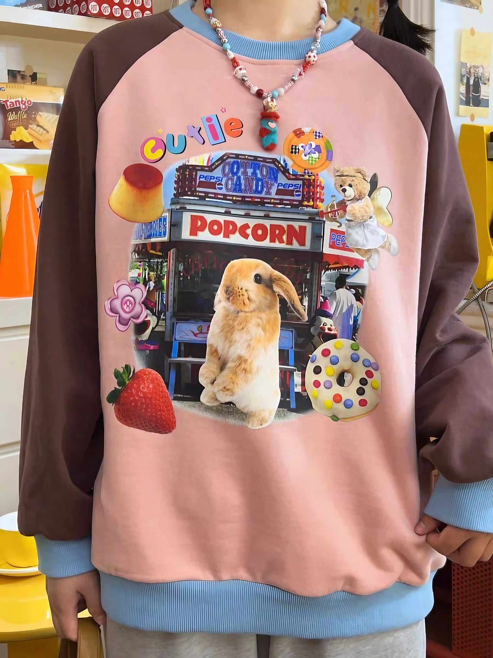 A youthful individual in a Gen Z inspired sweatshirt featuring a bunny design