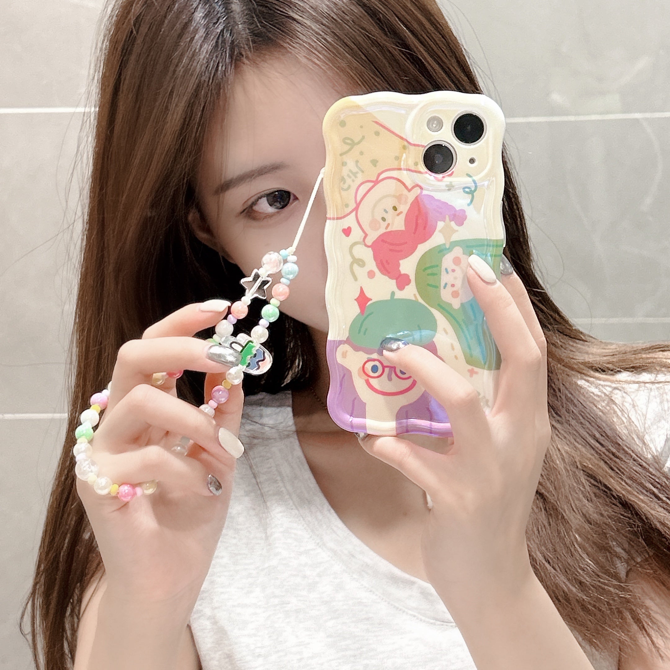 Young woman showcasing her iPhone 14 Pro Max in a coquette-style case with character