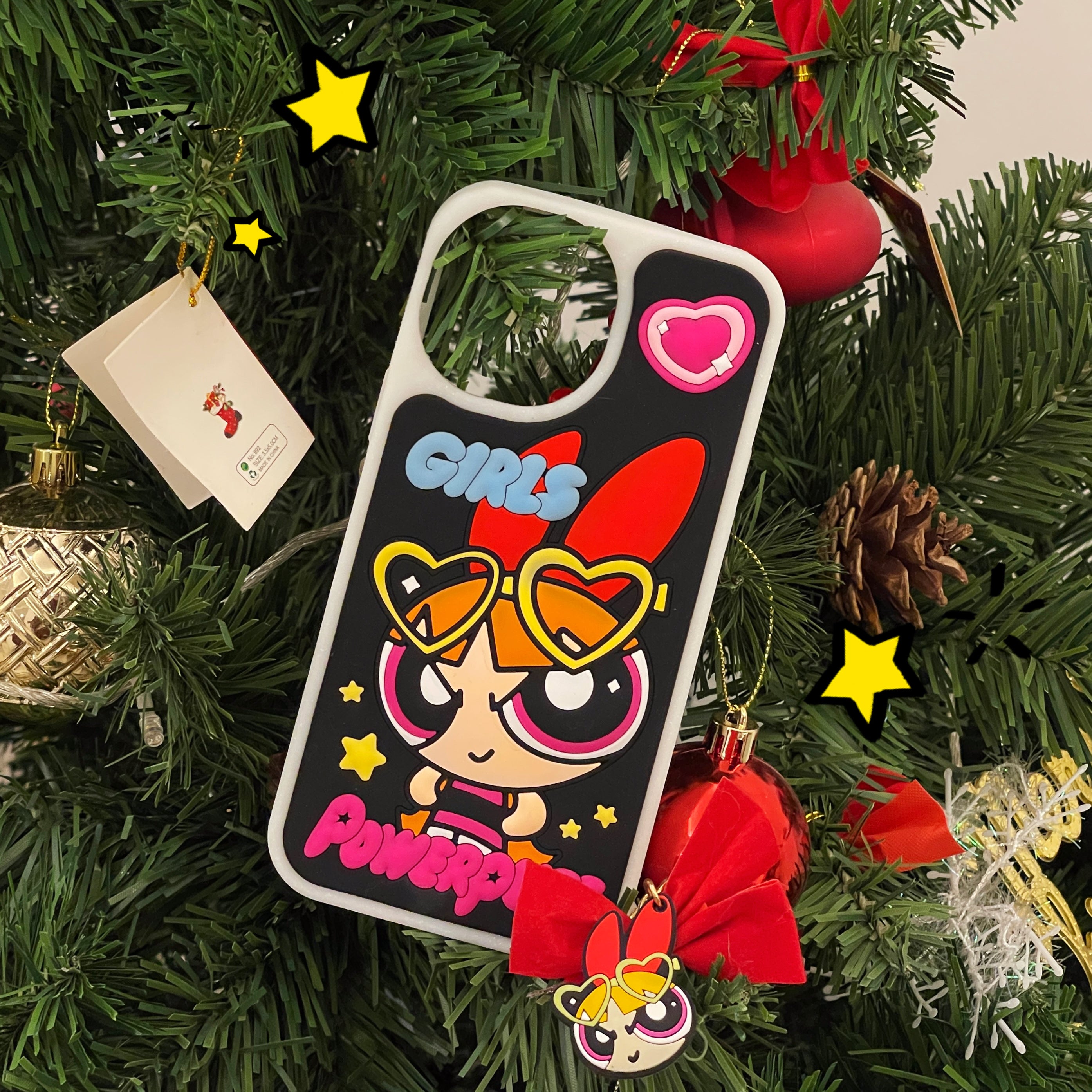 Powerpuff Girls iPhone case hanging as an ornament on a festive Christmas tree