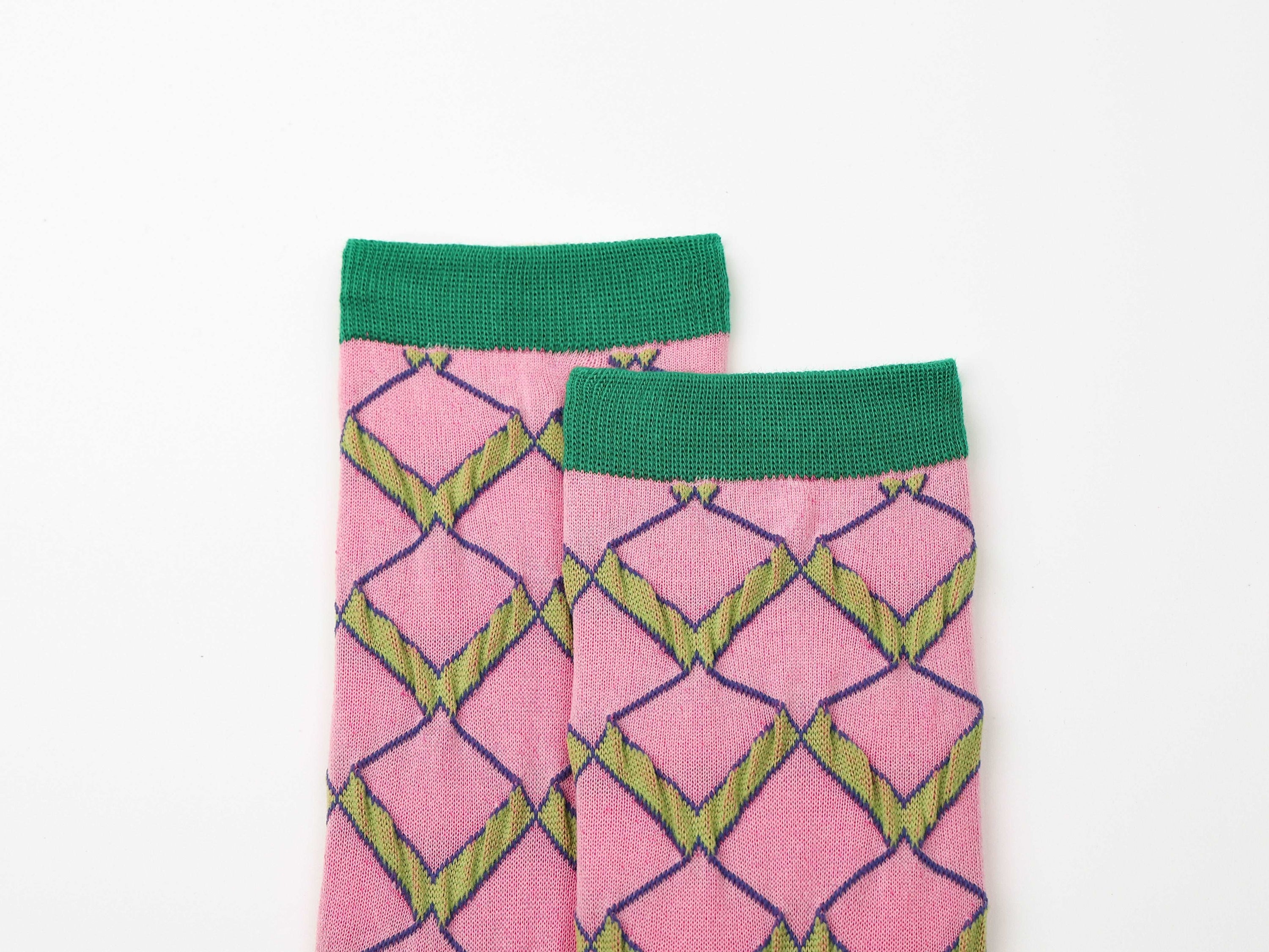 A set of three colorful and patterned socks from the 1+2 Socks Collection