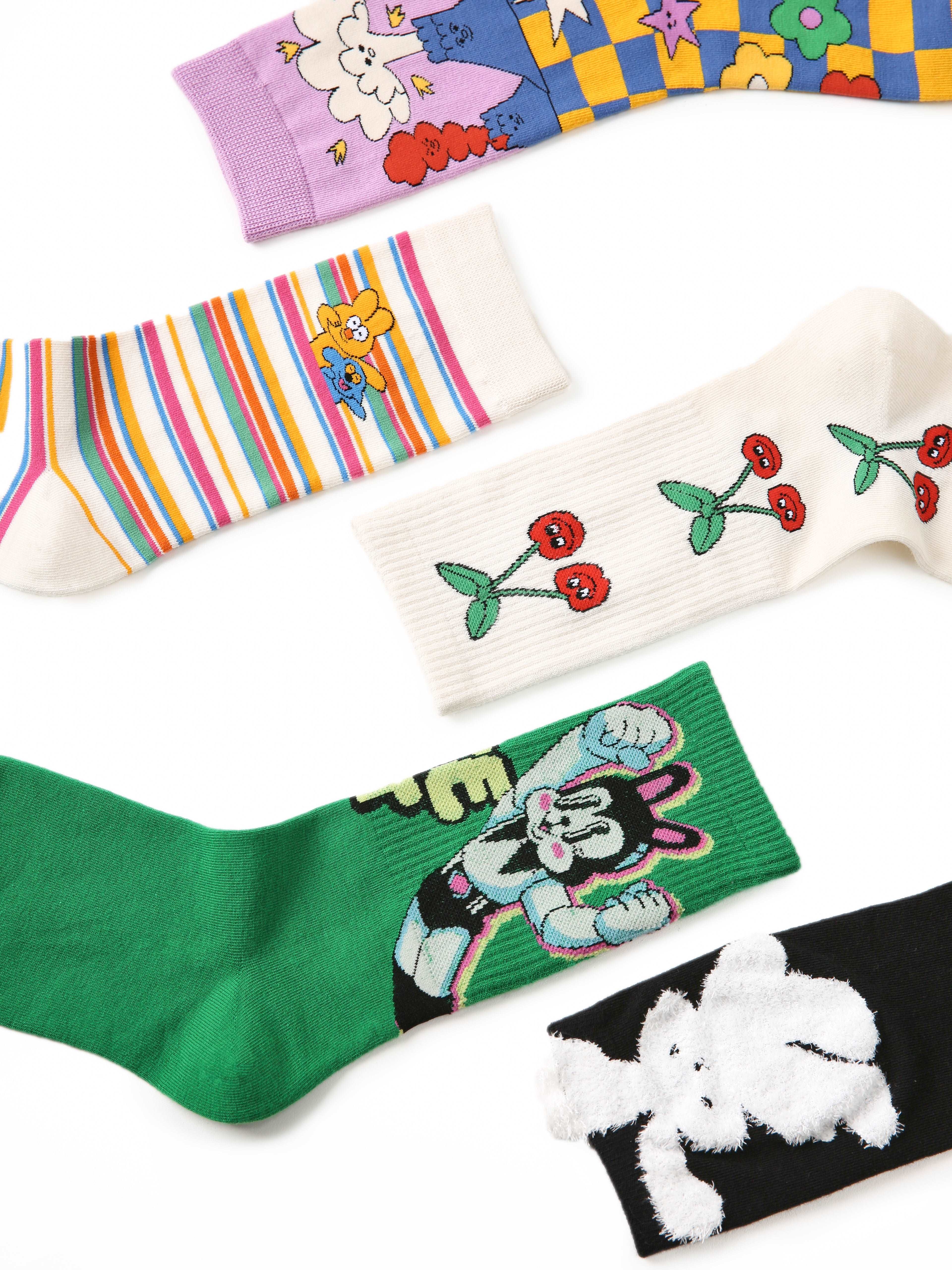 A variety of socks from the set, all showcasing different cartoon characters on each pair